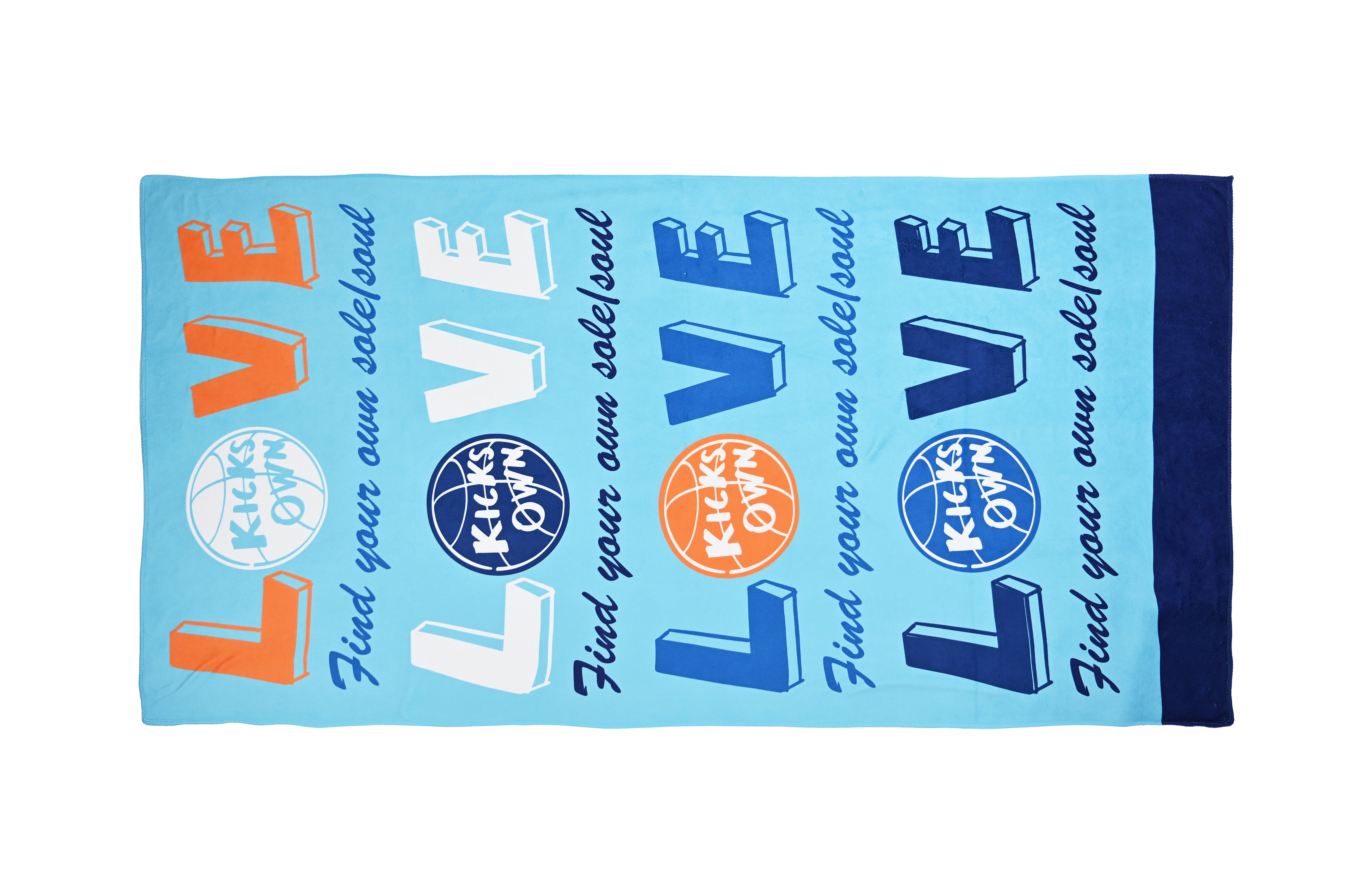 Towel with KICKSOWN text and branding on a blue background