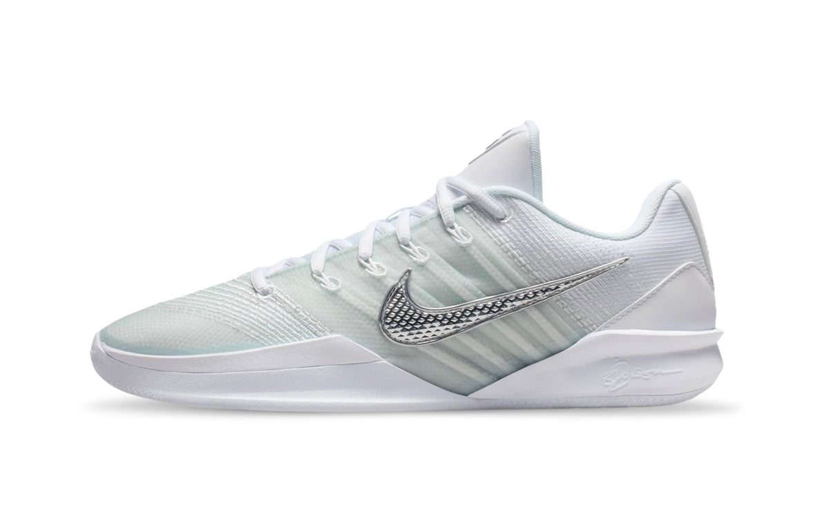 Nike Sabrina 3 basketball shoe, side view showing a white upper, textured silver Swoosh and white sole.